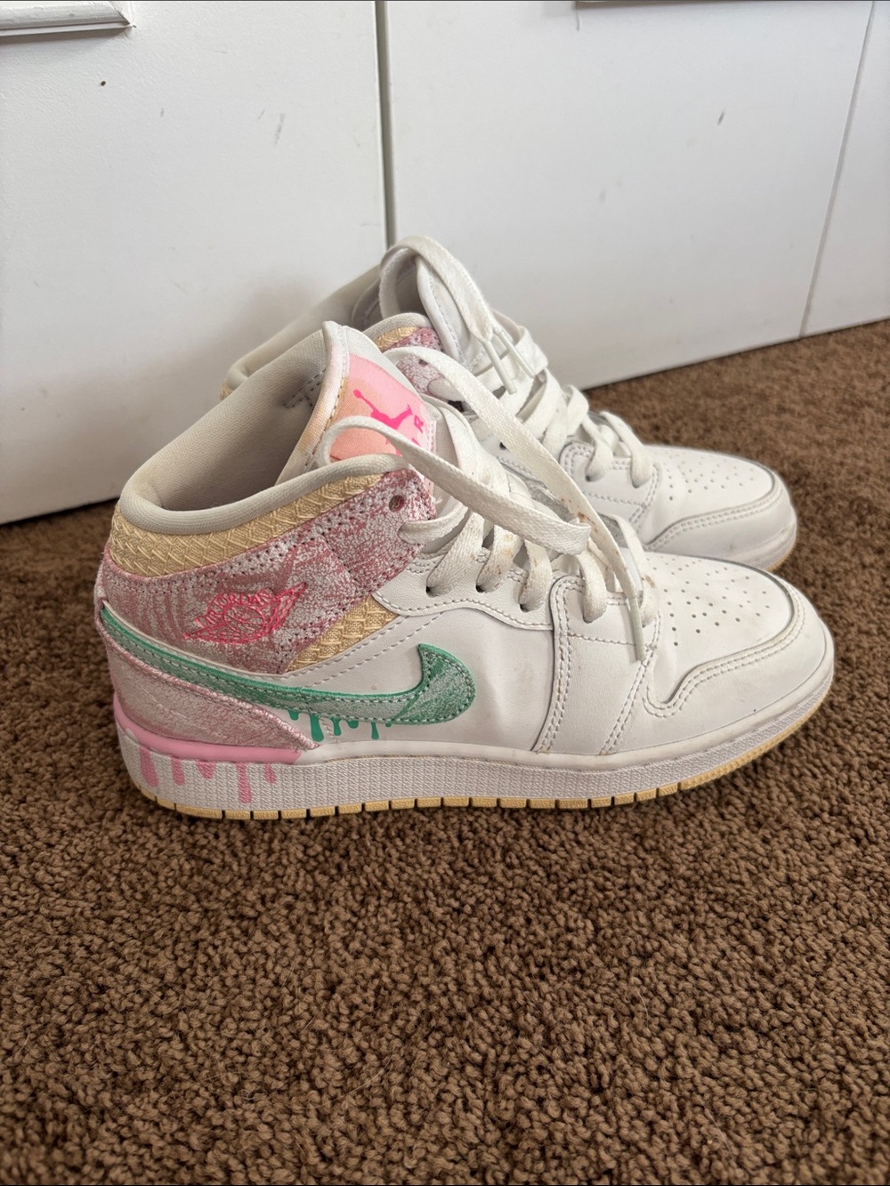 Nike Air Jordan 1 Mid SE "Ice Cream" sneakers featuring a paint drip design.